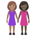 👩🏽‍🤝‍👩🏿 women holding hands: medium skin tone, dark skin tone display on JoyPixels